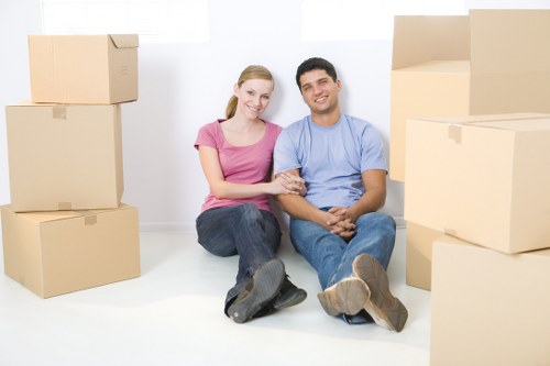 Professional movers handling fragile items in Kensington